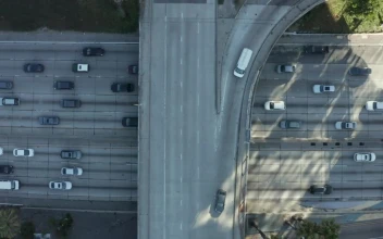 Free Video Stock traffic on a vehicular bridge over a highway