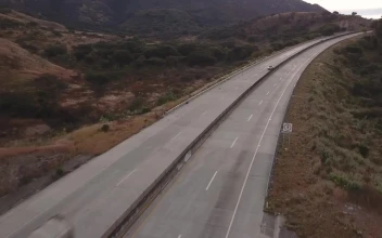 Free Video Stock traffic on the highway between the hills
