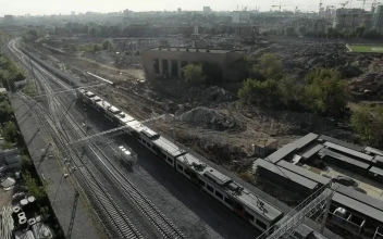 Free Video Stock train heading away from an industrial city
