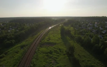 Free Video Stock train heading through rural landscape