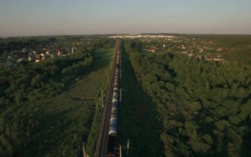 Free Video Stock train heading towards a rural town