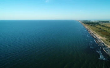 Free Stock Video Waves Of A Long Blue Sea Reaching The Beach