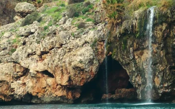 Free Stock Video Waterfall On A Rocky Shoreline By The Sea