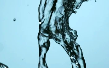 Free Stock Video Water Falling In Slow Motion On A Blue Background