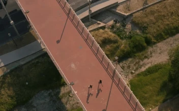 Free Stock Video Two People Jogging Across A Footbridge