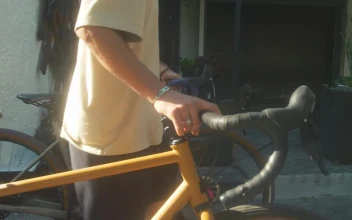 Free Stock Video Two Cyclists Walking Down The Street
