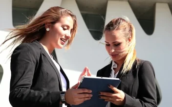 Free Stock Video Two Business Women Commenting On Something On A Tablet