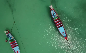 Free Stock Video Two Canoes In The Sea Near The Shore