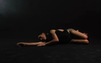 Free Stock Video Two Ballerinas Lying On The Floor On A Black Background