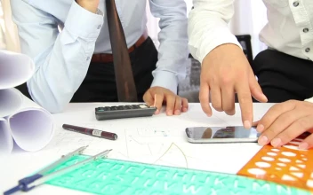 Free Stock Video Two Architects Discussing A Project On A Desk