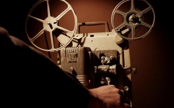 Free Stock Video Turning On A Vintage Film Projector