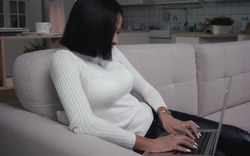 Free Stock Video Young Woman With Laptop Working In The Couch
