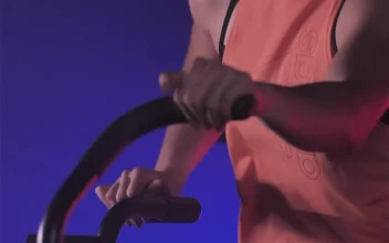 Free Stock Video Young Woman Using An Air Bike In Her Workout