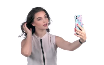 Free Stock Video Young Woman Takes Selfies With A Smartphone