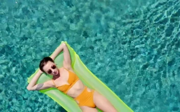 Free Stock Video Young Woman Sunbathing On A Inflatable Pool Bed