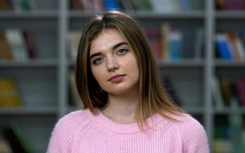 Free Stock Video Young Woman Smiling Into The Camera In A Library