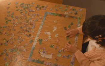 Free Stock Video Young Woman Putting Together A Puzzle