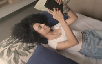 Free Stock Video Young Woman On A Video Call Lying On A Bed