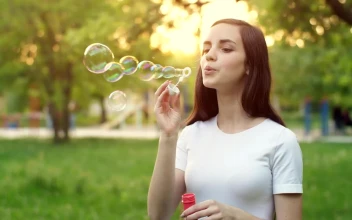 Free Stock Video Young Woman In A Park Blowing Soap Bubbles