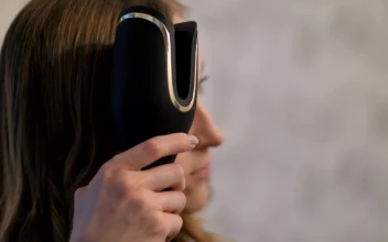 Free Stock Video Young Woman Curling Her Hair