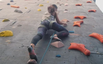 Free Stock Video Young Woman Climbing A Large Mountaineering Wall