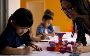 Free Stock Video Young Teacher Checking Her Little Students Work