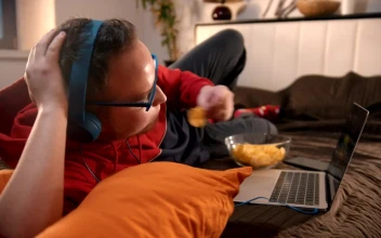 Free Stock Video Young Man Watching Videos And Eating Snacks