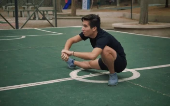 Free Stock Video Young Man Stretching On The Court In A Park