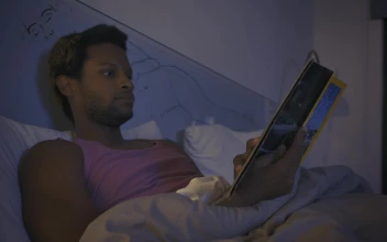 Free Stock Video Young Man Reading A Book Before Going To Sleep