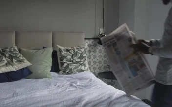 Free Stock Video Young Man Laying On A Bed Reading The Newspaper