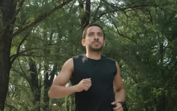 Free Stock Video Young Man Jogging In A Park With Many Trees