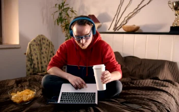 Free Stock Video Young Man Eating Snacks Browsing The Internet
