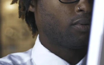 Free Stock Video Young Man Adjusting His Glasses While Working On Computer