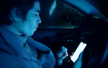 Free Stock Video Young Male Driver Scrolling On His Smartphone