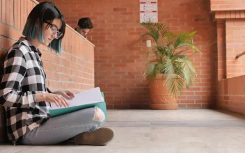 Free Stock Video Young Female Student Reviewing Her Notes At Her School