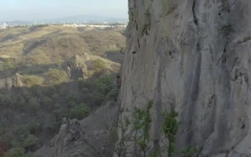 Free Stock Video Young Female Mountaineer Climbing A Large Rocky Mountain Small