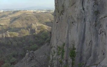 Free Stock Video Young Female Mountaineer Climbing A Large Rocky Mountain