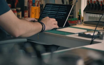 Free Stock Video Young Engineer Programming In His Workshop Seen Up Close