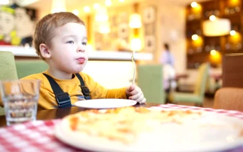 Free Stock Video Young Boy Eating Pizza At A Cafe
