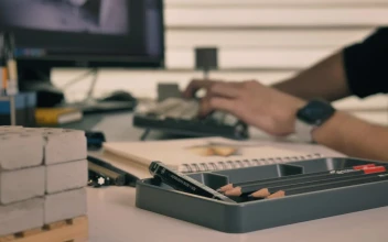 Free Stock Video Working On A Computer Surrounded By Artifacts For Drawing