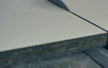 Free Stock Video Wooden Board Being Cut With A Saw