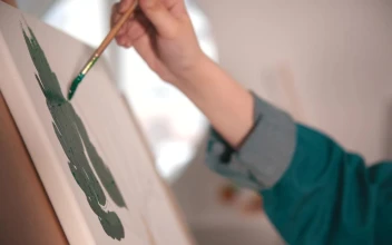 Free Stock Video Womans Hand Painting Green Color On Canvas