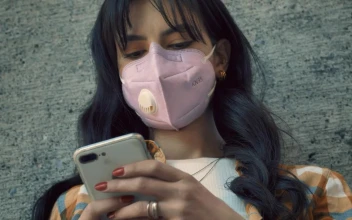 Free Stock Video Woman With Face Mask Texting On Her Smartphone