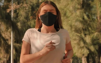 Free Stock Video Woman Wearing A Face Mask While Jogging