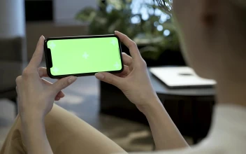 Free Stock Video Woman Watching A Mobile Phone With A Green Screen