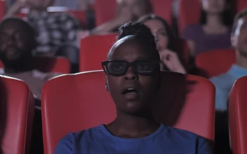 Free Stock Video Woman Watching A Film In A Movie Threater