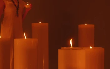 Free Stock Video Woman Walking Among Huge Candles