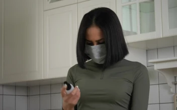 Free Stock Video Woman Using The Hand Sanitizer In The Kitchen