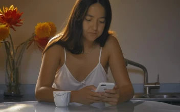 Free Stock Video Woman Using Her Cell Phone While Drinking Morning Coffee