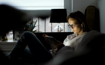 Free Stock Video Woman Using A Tablet Lying On The Couch
